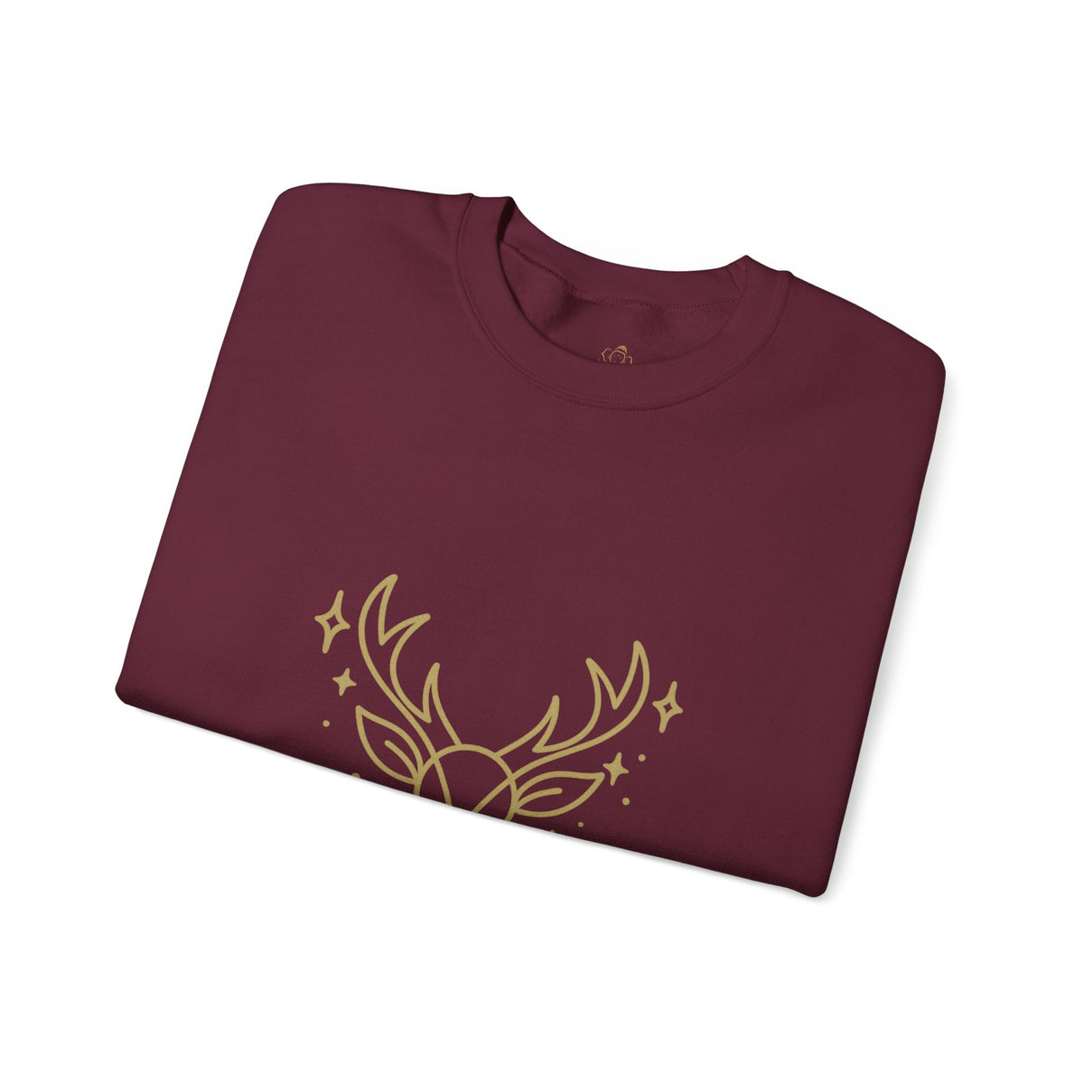 Folded maroon sweatshirt showing minimalist gold-colored reindeer print