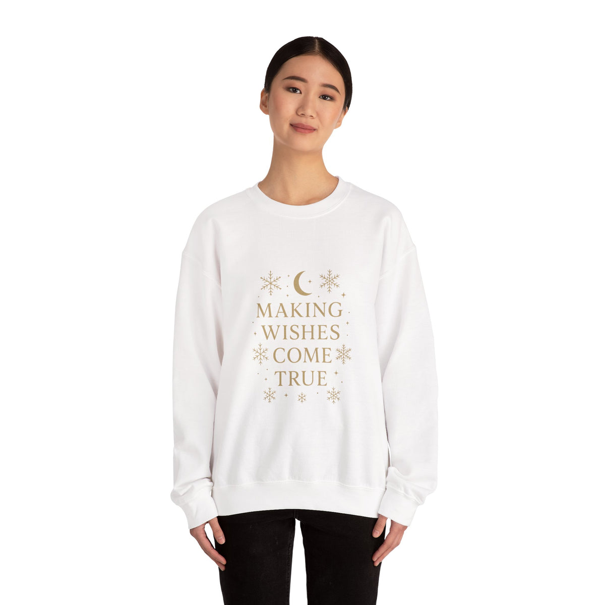 Model wearing a white Making Wishes Come True moon and snowflake sweatshirt