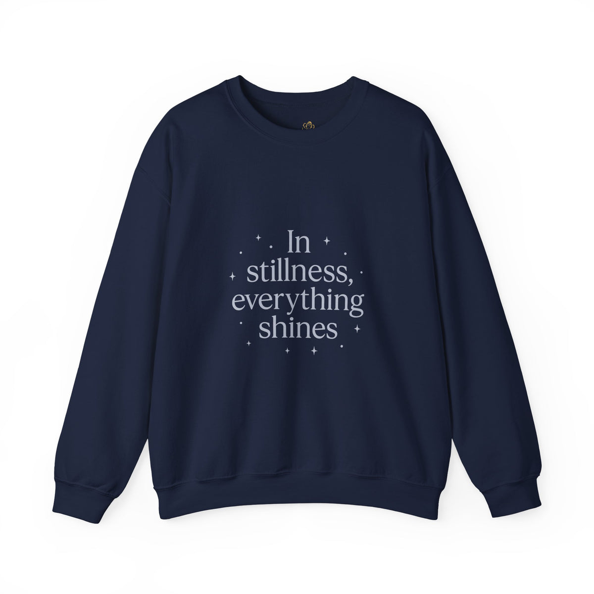 Navy sweatshirt with "In stillness, everything shines" and a small snowflake