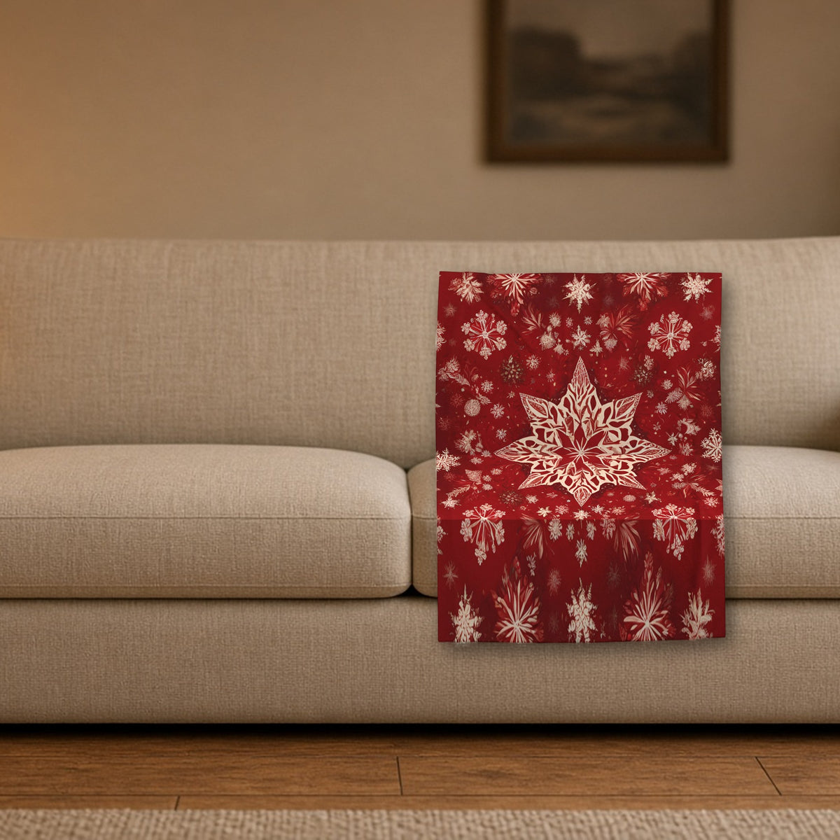 Red Star & Snowflake velveteen blanket styled on a sofa in a cozy living room