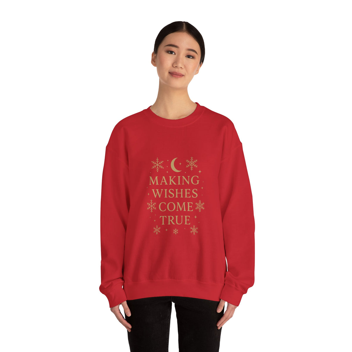 Model wearing a red Making Wishes Come True moon and snowflake sweatshirt