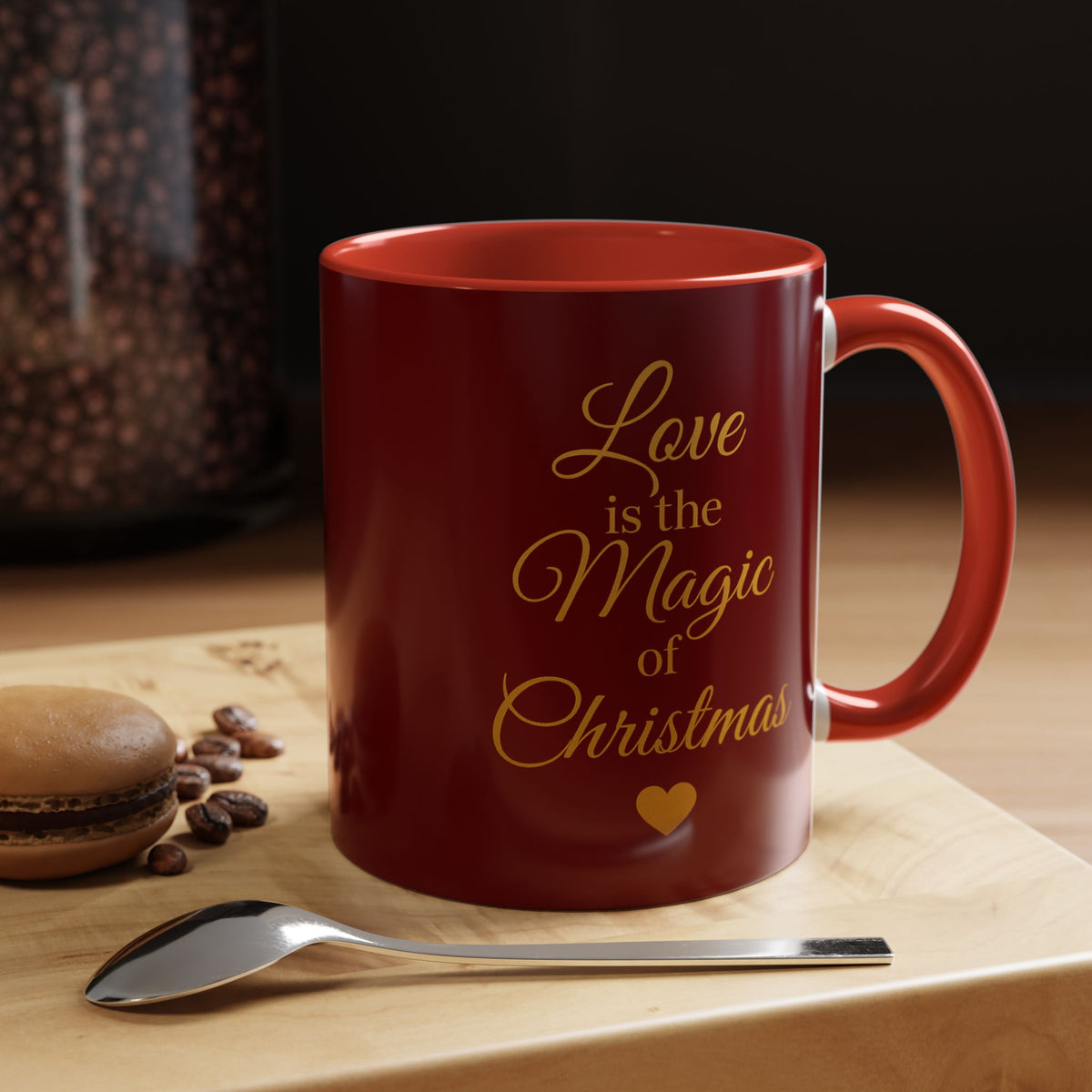 Burgundy Christmas mug displayed beside cookies, spices and a spoon