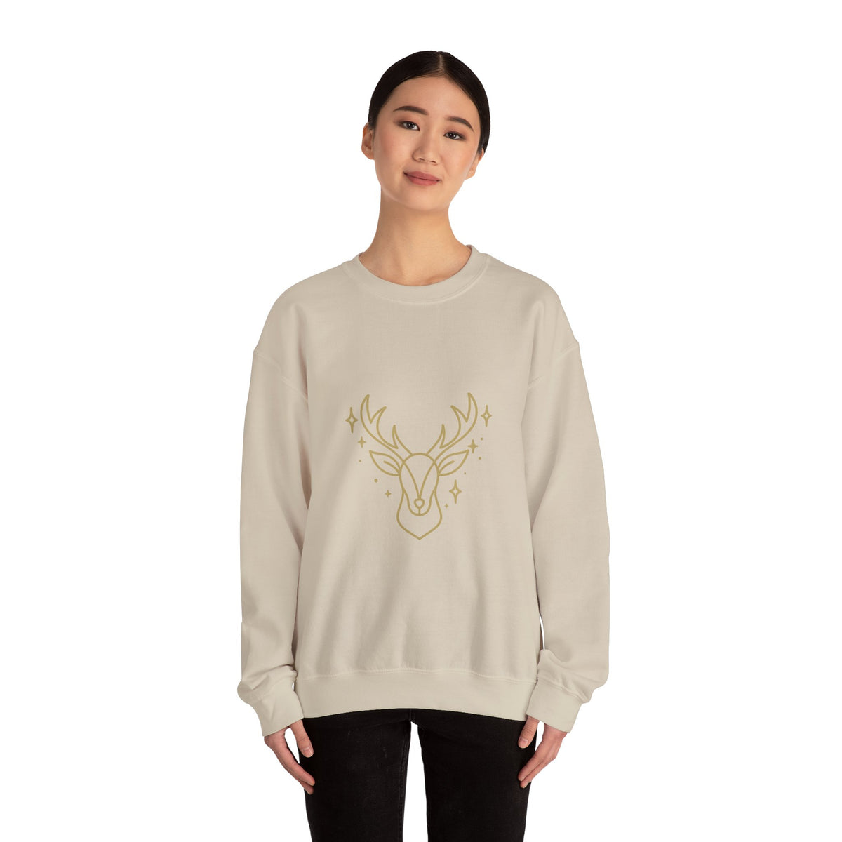 Model wearing a sand minimalist gold-colored reindeer sweatshirt