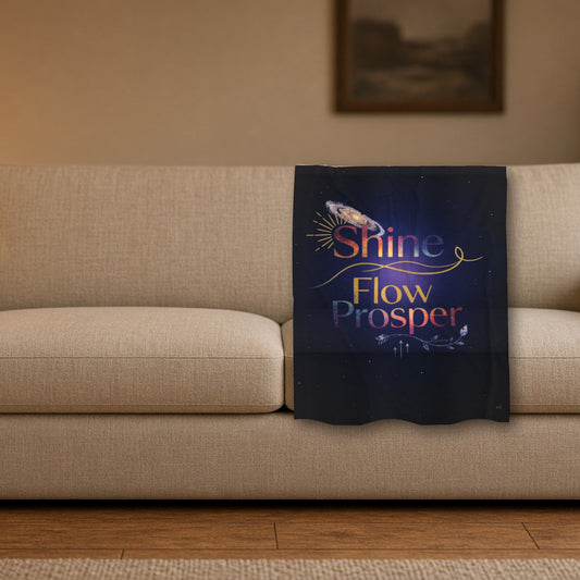 Shine Flow Prosper velveteen throw blanket styled on a sofa in a cozy living room