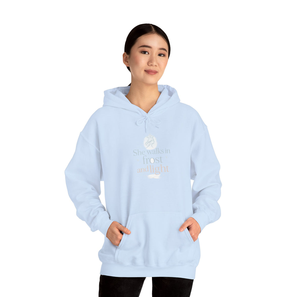 Model wearing a light blue She Walks in Frost and Light hoodie