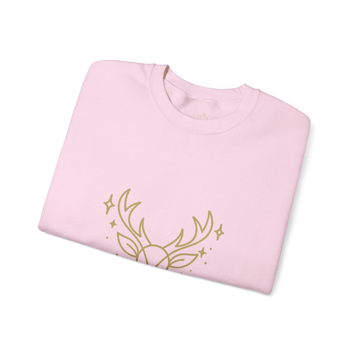 Folded light pink sweatshirt showing minimalist gold-colored reindeer print