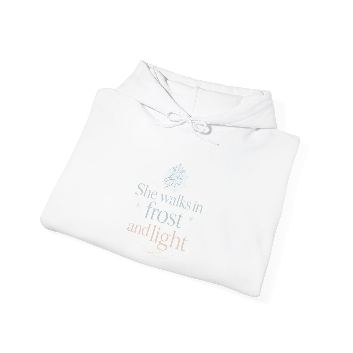 Folded white hoodie showing the She Walks in Frost and Light moon print
