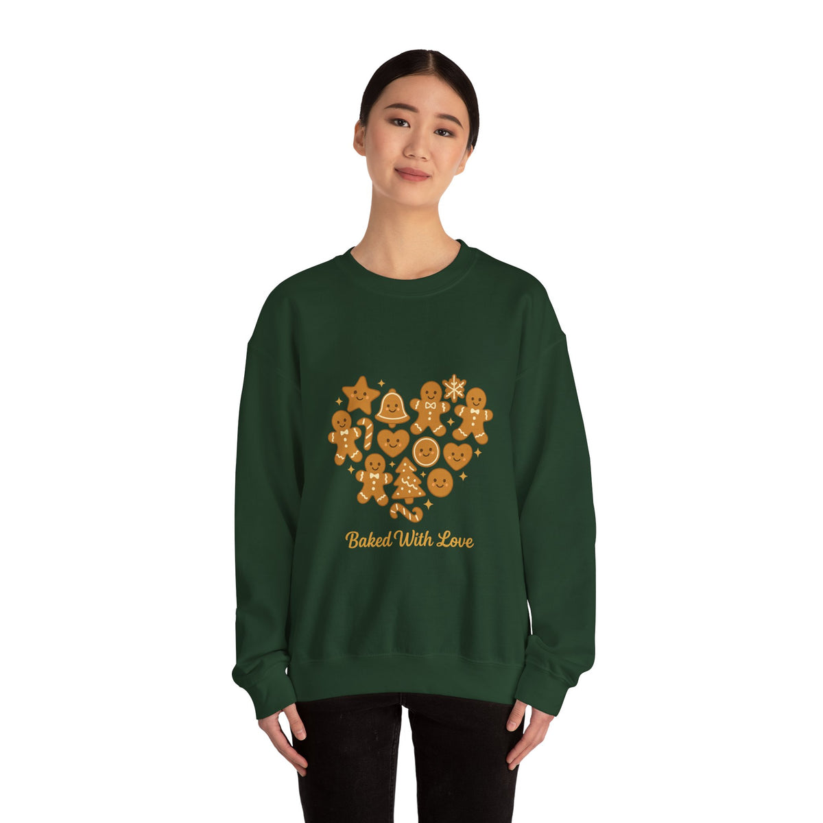 Model wearing a forest green Baked With Love gingerbread heart sweatshirt