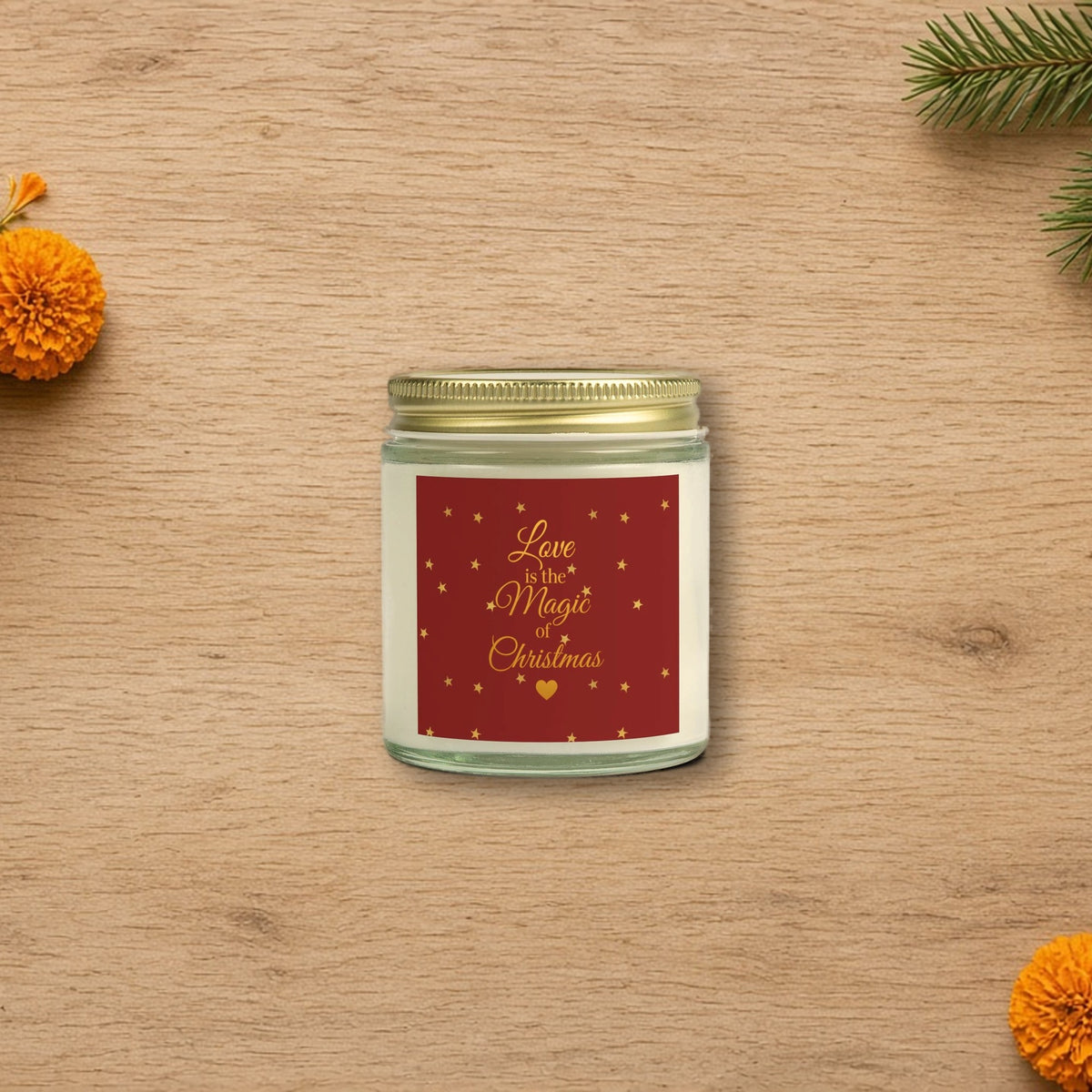 Love Is the Magic of Christmas Candle styled on a cozy wooden table
