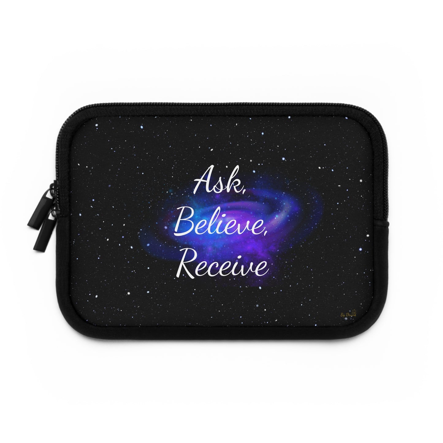 Black laptop sleeve with galaxy background and white affirmation text “Ask. Believe. Receive.” plus gold By Druvs logo