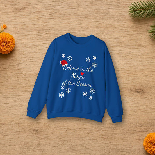 Believe in the Magic of the Season sweatshirt laid flat in a styled lifestyle setting