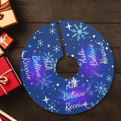 Ask Believe Receive cosmic Christmas tree skirt laid flat with wrapped presents