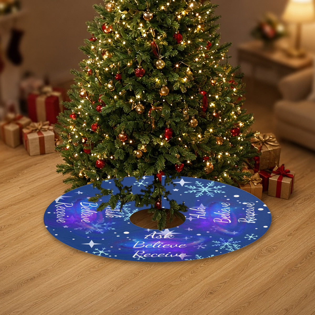 Ask Believe Receive cosmic Christmas tree skirt under a decorated Christmas tree with wrapped gifts