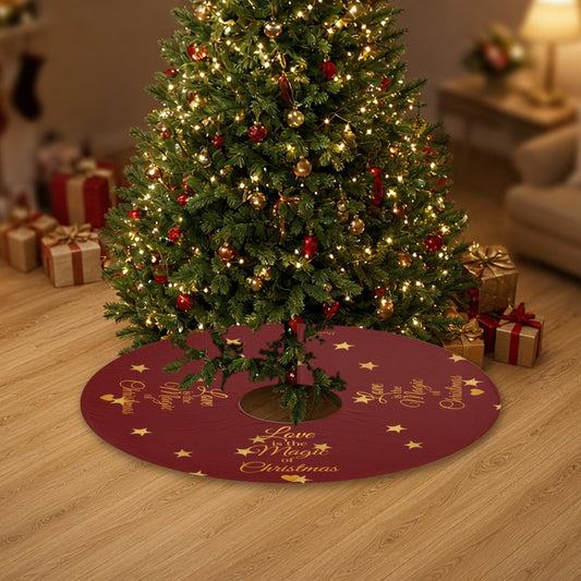 Love Is the Magic of Christmas red and gold Christmas tree skirt under a decorated Christmas tree with wrapped gifts