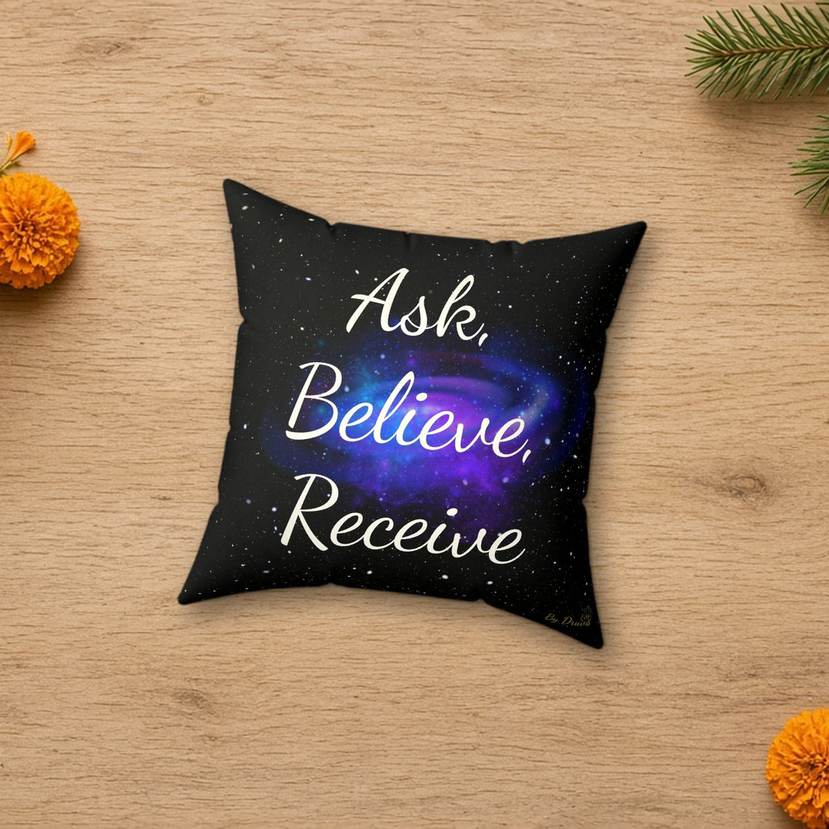 Ask Believe Receive Galaxy Cushion in a styled lifestyle flat lay