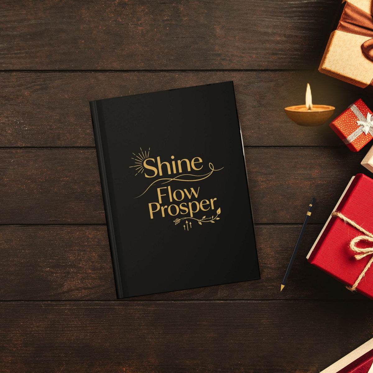 Shine Flow Prosper Luxe Manifestation Journal in a festive flat lay with a candle, pen and Christmas gifts