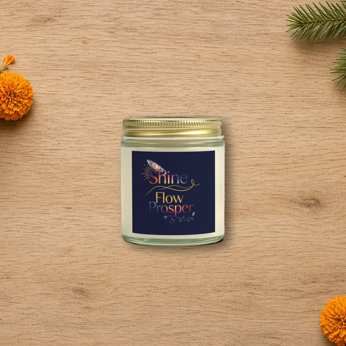 Shine Flow Prosper luxe cosmic scented candle styled on a cozy wooden table