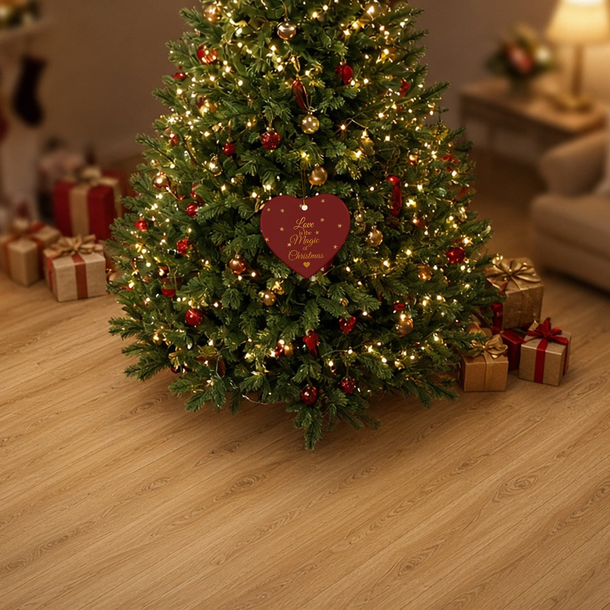 Love Is the Magic of Christmas Heart Ornament hanging on a decorated Christmas tree