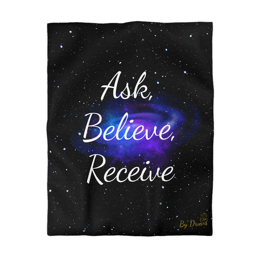 Black duvet cover with galaxy swirl and white text “Ask, Believe, Receive” by Druvs – spiritual bedding design.