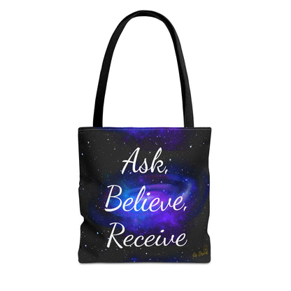 Black tote bag with purple galaxy swirl and white text “Ask, Believe, Receive” by Druvs – spiritual law of attraction accessory.