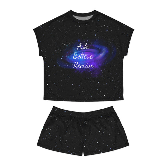 Black galaxy pajama set with “Ask. Believe. Receive.” printed on top
