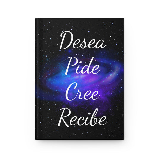 Diario cósmico con texto en español “Desea, Pide, Cree, Recibe” sobre fondo de galaxia púrpura y negra.