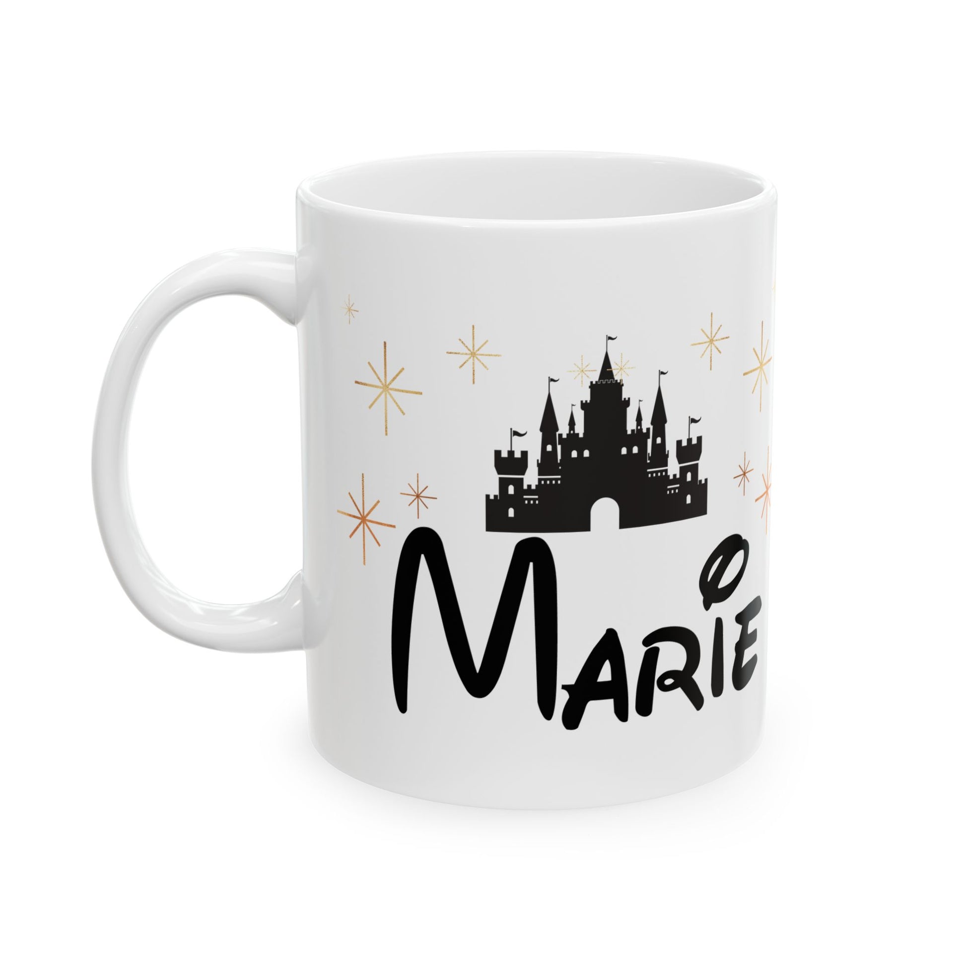 White ceramic mug with black castle, gold stars, and custom name "Marie" in fantasy-style font.