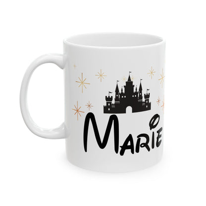 White ceramic mug with black castle, gold stars, and custom name "Marie" in fantasy-style font.