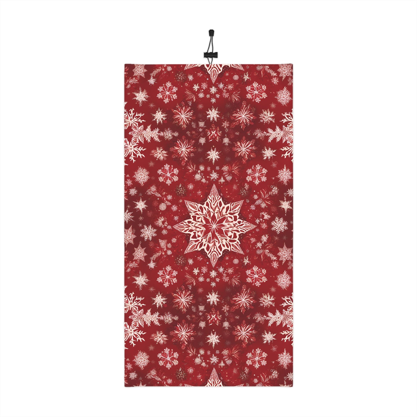 Flatlay of red neck gaiter with white snowflake print and drawstring
