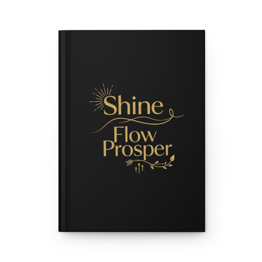 Hardcover black journal with gold Shine Flow Prosper text – luxe affirmation notebook by Druvs for manifesting and mindful writing.