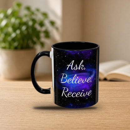 Ask Believe Receive two-tone manifestation mug on a cozy morning desk